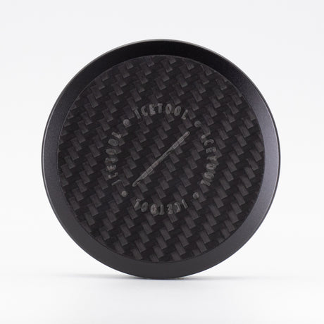 Icetool Slim Can Carbon, straight-on view of the handmade carbon fiber lid and black anodized aluminum body.