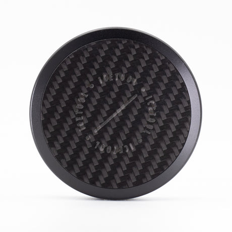 Icetool Tri Can Carbon nicotine pouch case, straight-on view of the handmade carbon fiber lid and black aluminum body.