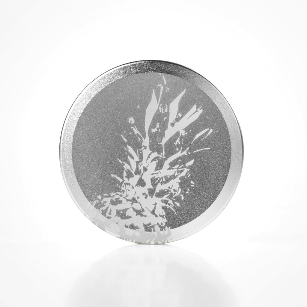Icetool Slim Can for portion snus and nicotine pouches. Silver color anodised aluminum with pineapple graphics.